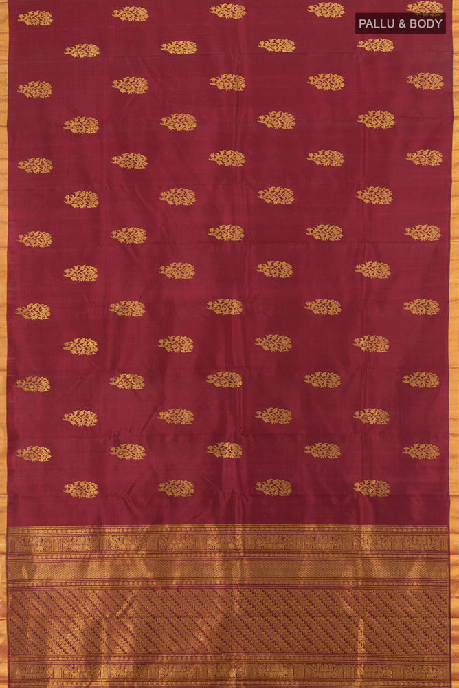 Flat view of Pure Silk Pure Zari Maroon Kanchipuram Saree with Zari Butta on the body and Silk Border. 