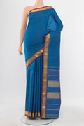 Light Blue Kanchipuram Silk Saree with Zari Butta on the body and Silk Border.  displayed on a mannequin