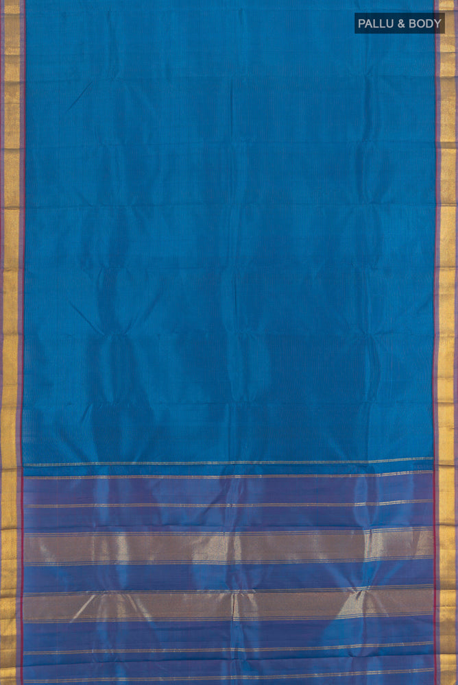 Flat view of Light Blue Kanchipuram Silk Saree with Zari Butta on the body and Silk Border. 