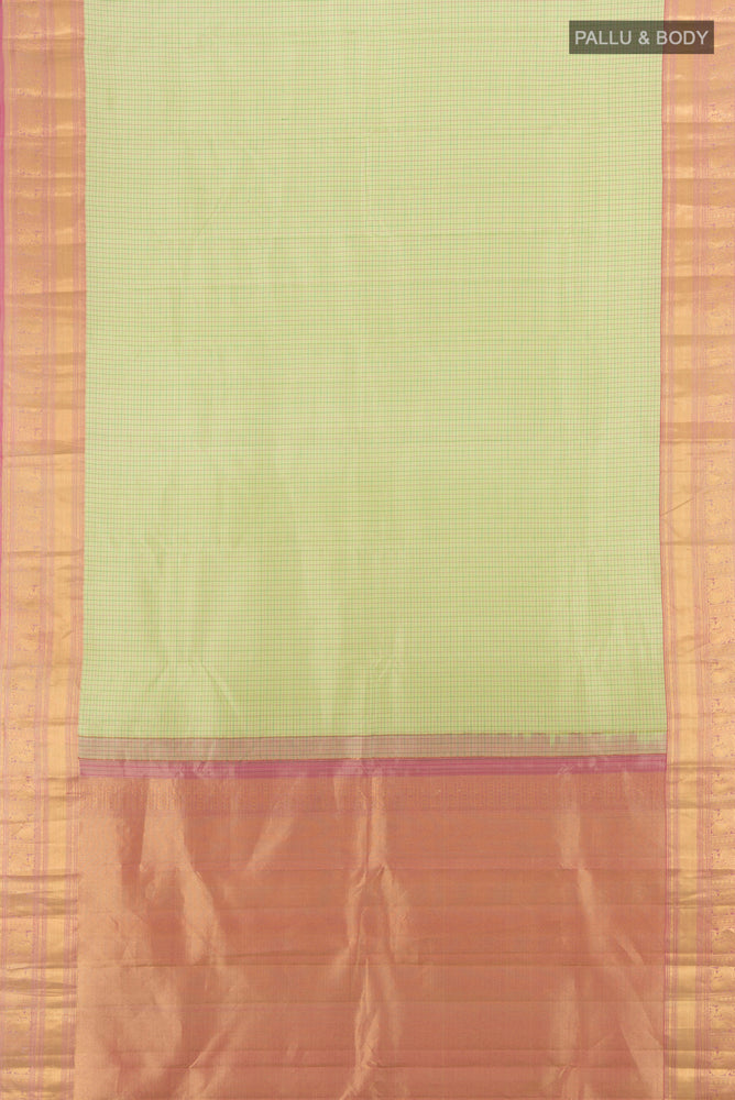Flat view of Pista Green Kanchipuram Silk Saree with Zari Butta on the body and Silk Border. 