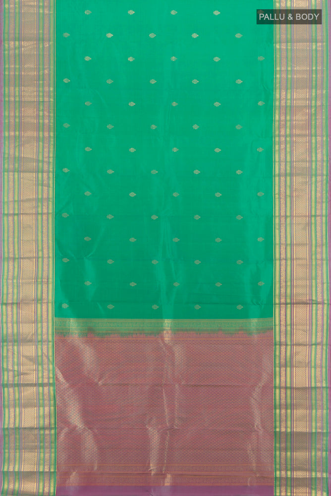 Flat view of Pure Silk Pure Zari Light Blue Kanchipuram Saree with Zari Butta on the body and Silk Border. 