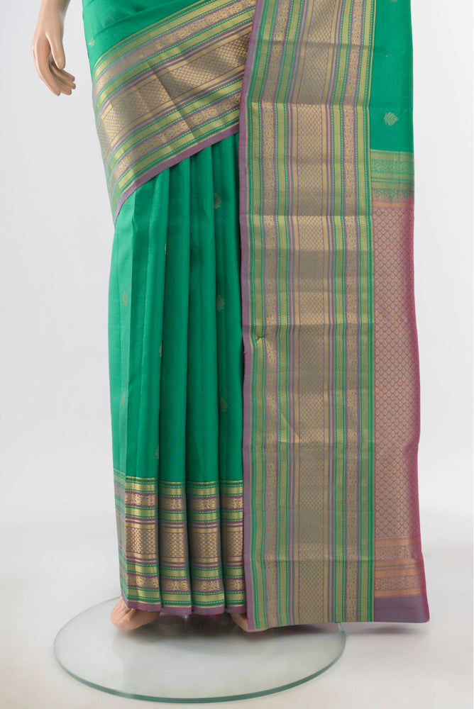 Pleats and pallu of Pure Silk Pure Zari Light Blue Kanchipuram Saree with Zari Butta on the body and Silk Border. 
