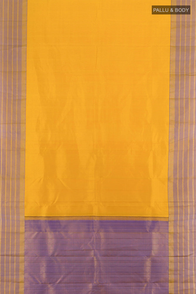 Flat view of Mustard Kanchipuram Silk Saree with Zari Butta on the body and Silk Border. 