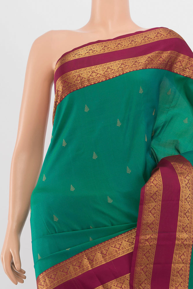 Border image of Peacock Blue Kanchipuram Silk Saree with Zari Butta on the body and Silk Border. 