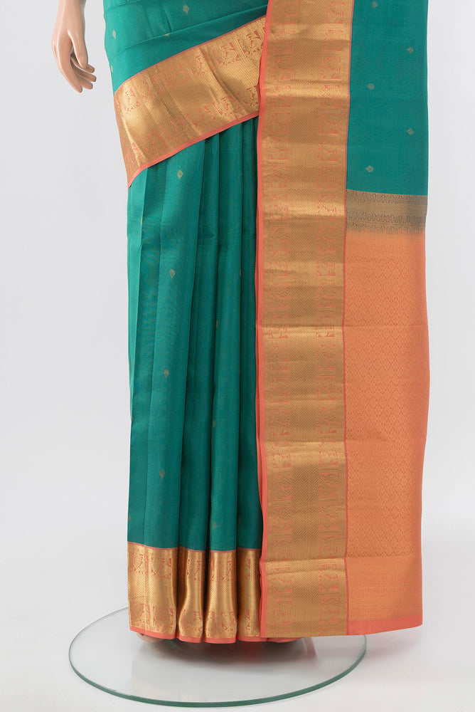 Pleats and pallu of Pure Silk Pure Zari Sea Green Kanchipuram Saree with Zari Butta on the body and Silk Border. 