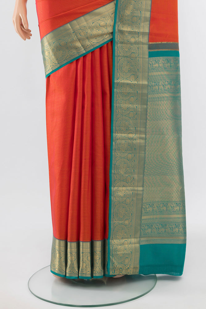Pleats and pallu of Pure Silk Pure Zari Peach Kanchipuram Saree with Zari Butta on the body and Silk Border. 