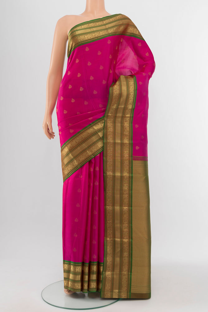 Light Magenta Kanchipuram Silk Saree with Zari Butta on the body and Silk Border.  displayed on a mannequin