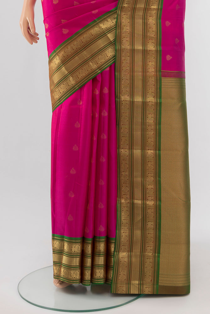 Pleats and pallu of Light Magenta Kanchipuram Silk Saree with Zari Butta on the body and Silk Border. 
