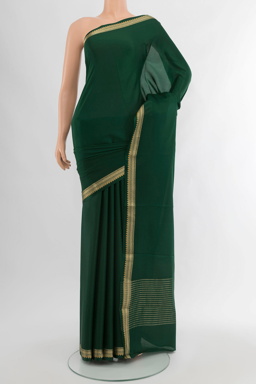 Bottle Green Mysore Crepe Saree with Plain Body and Zari Border.  displayed on a mannequin