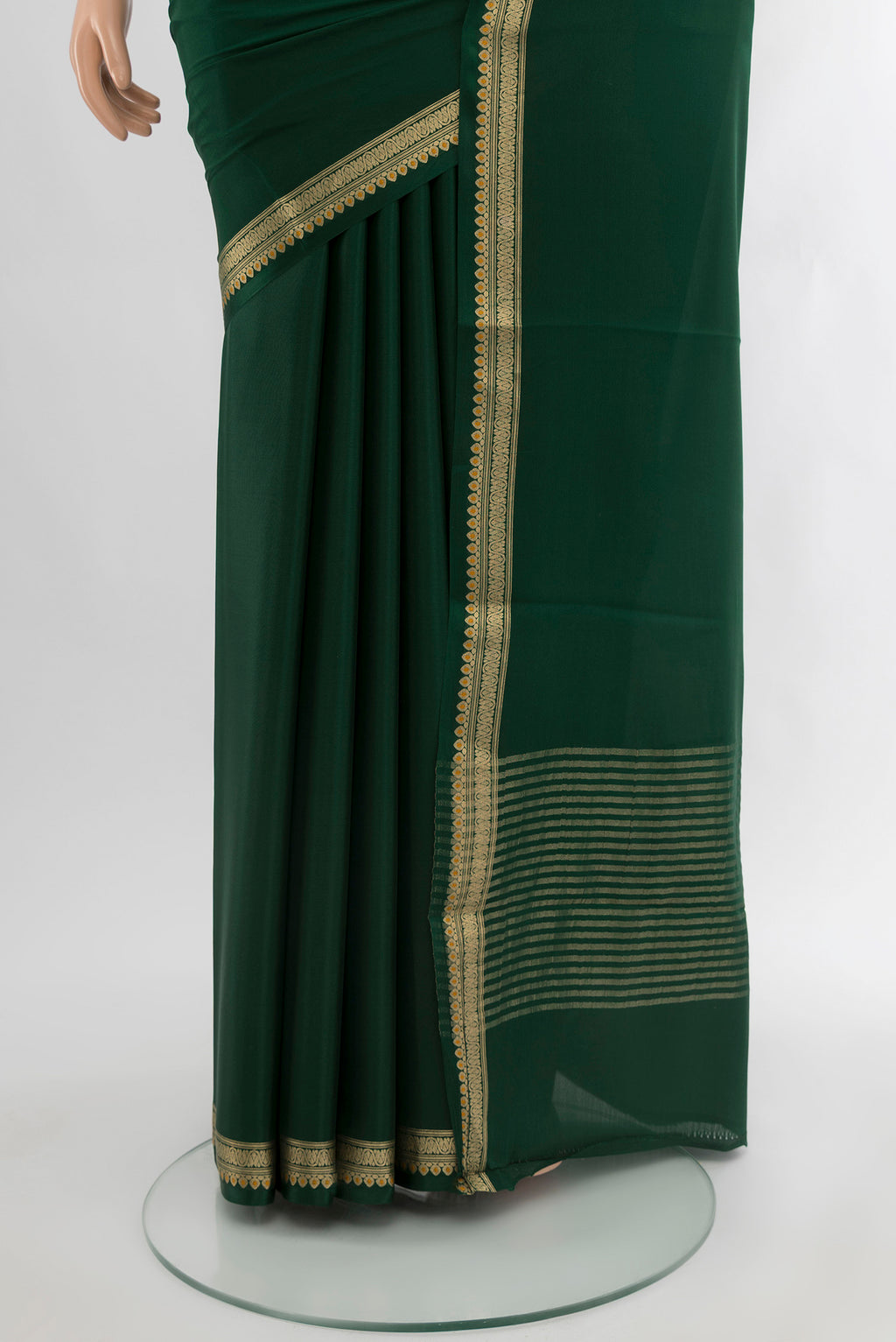 Pleats and pallu of Bottle Green Mysore Crepe Saree with Plain Body and Zari Border. 