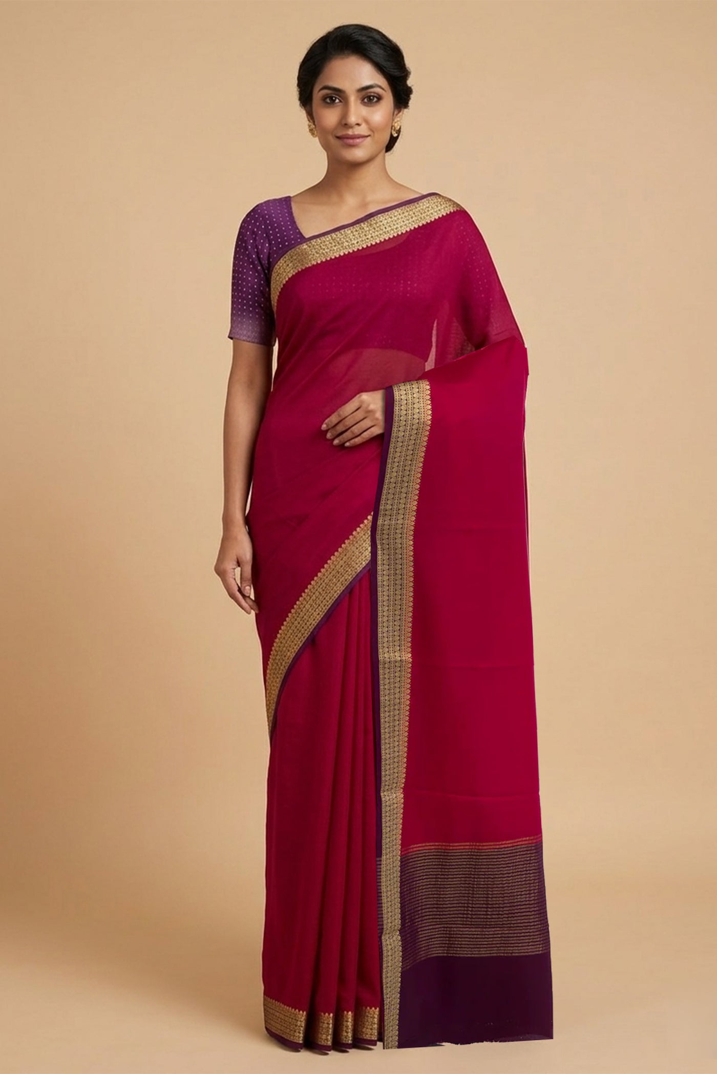 Model wearing a Pink Mysore Crepe Saree with Plain Body and Zari Border.