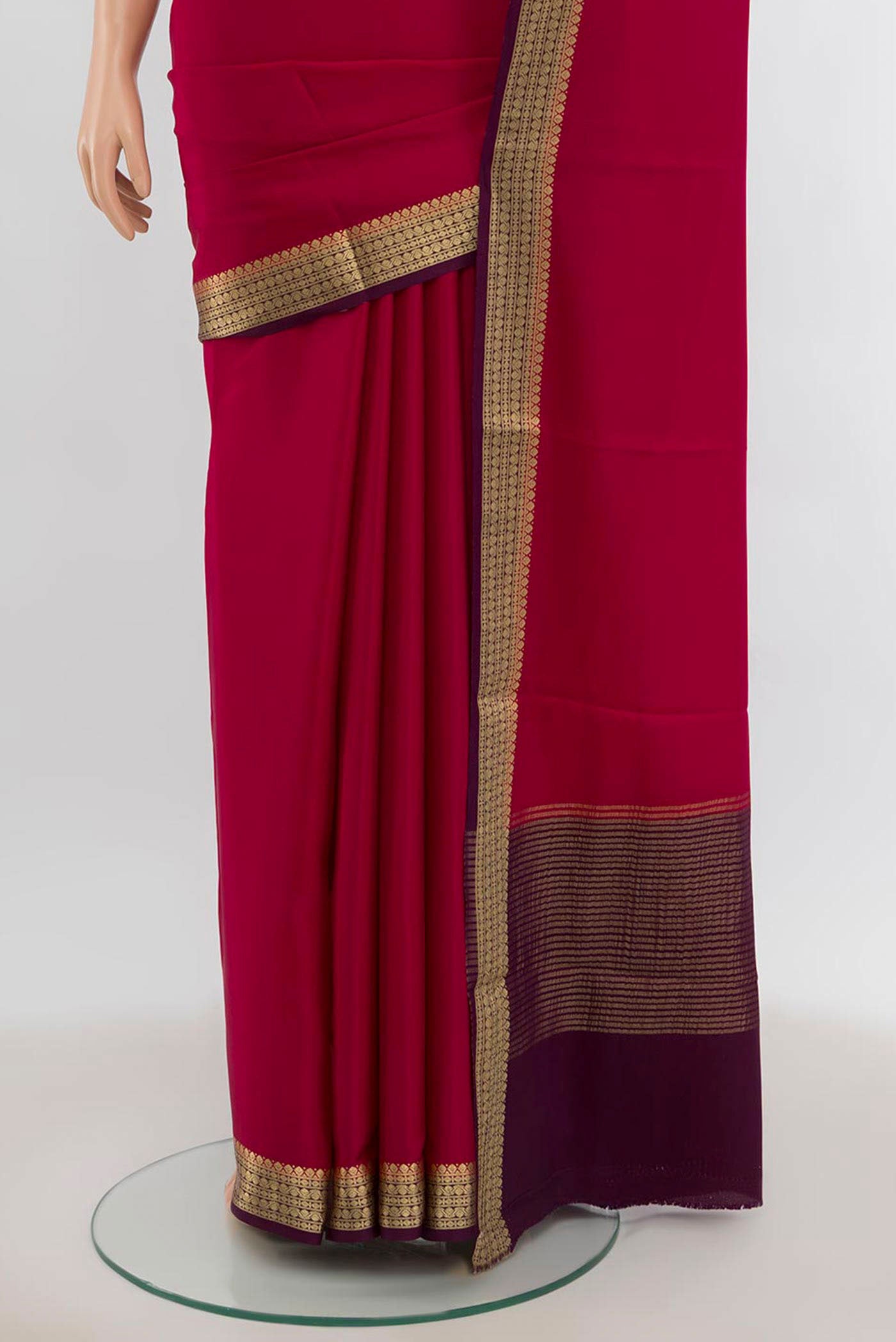 Pleats and pallu of Dark Pink Mysore Crepe Saree with Zari Butta on the body and Silk Border. 