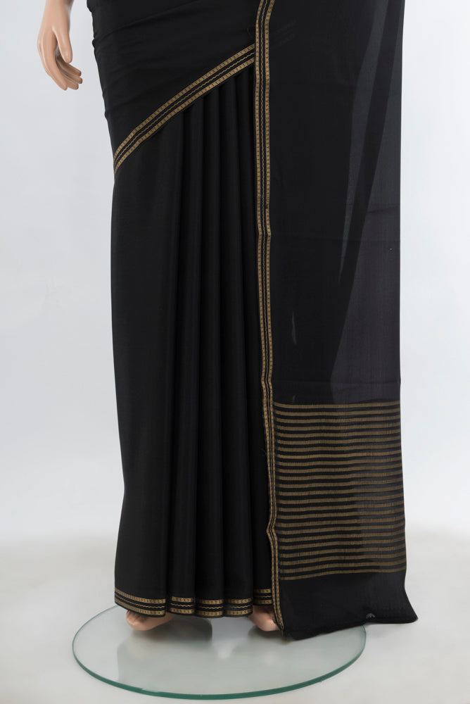 Pleats and pallu of Black Mysore Crepe Saree with Plain Body and Silk Border. 