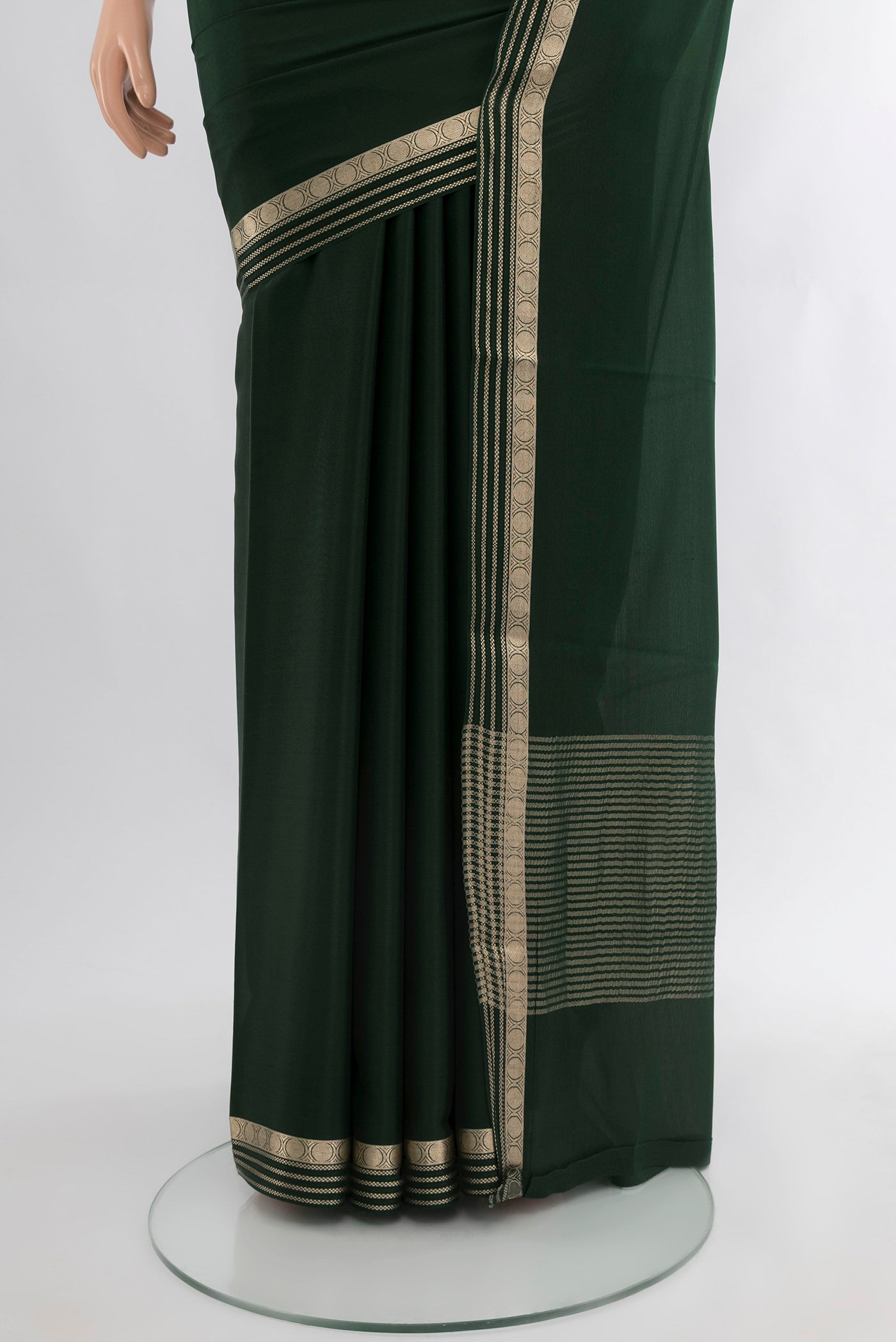 Pleats and pallu of Bottle Green Mysore Crepe Saree with Plain Body and Zari Border. 