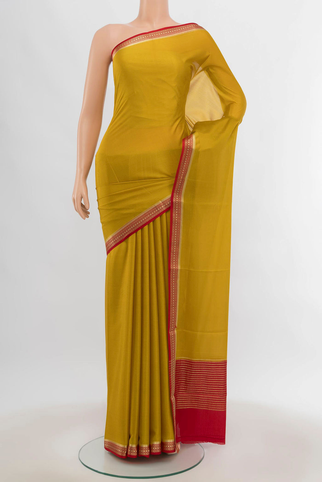 Yellow Mysore Crepe Saree with Zari Butta on the body and Silk Border.  displayed on a mannequin