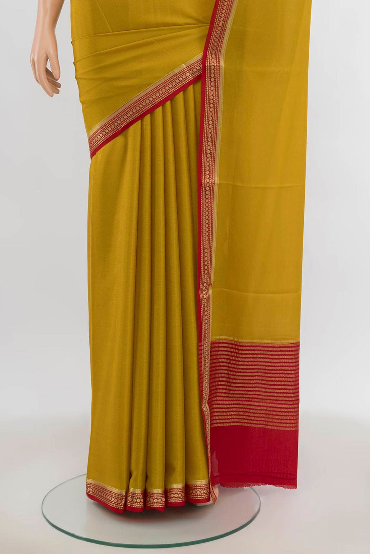 Pleats and pallu of Yellow Mysore Crepe Saree with Zari Butta on the body and Silk Border. 