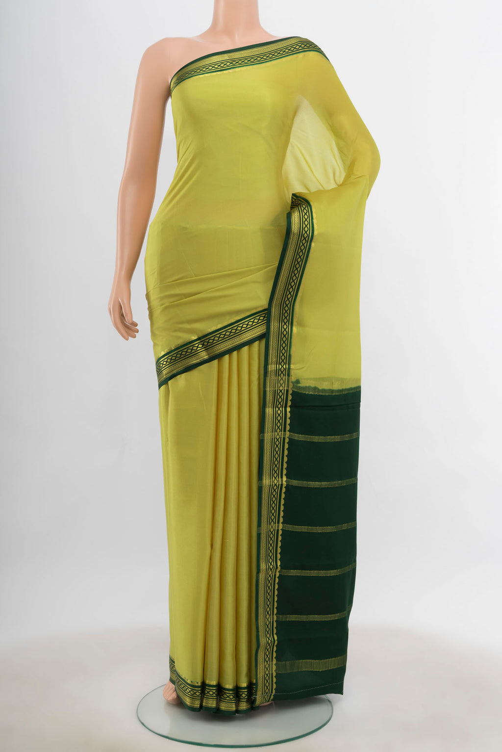 Light Green Mysore Crepe Saree with Zari Butta on the body and Silk Border.  displayed on a mannequin