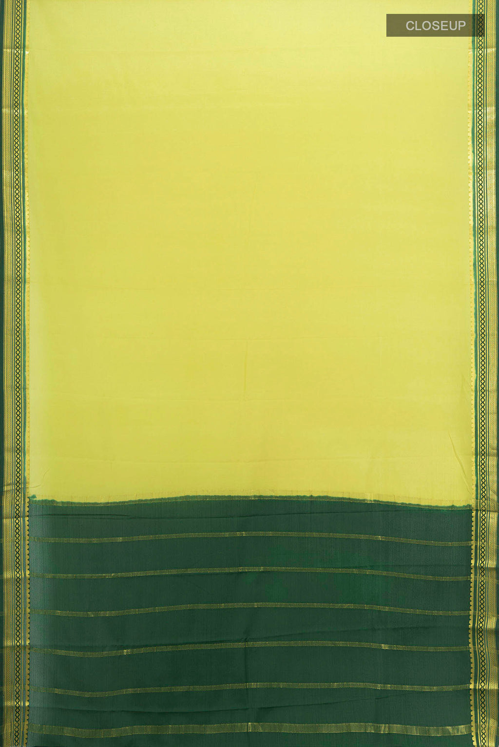 Flat view of Light Green Mysore Crepe Saree with Zari Butta on the body and Silk Border. 