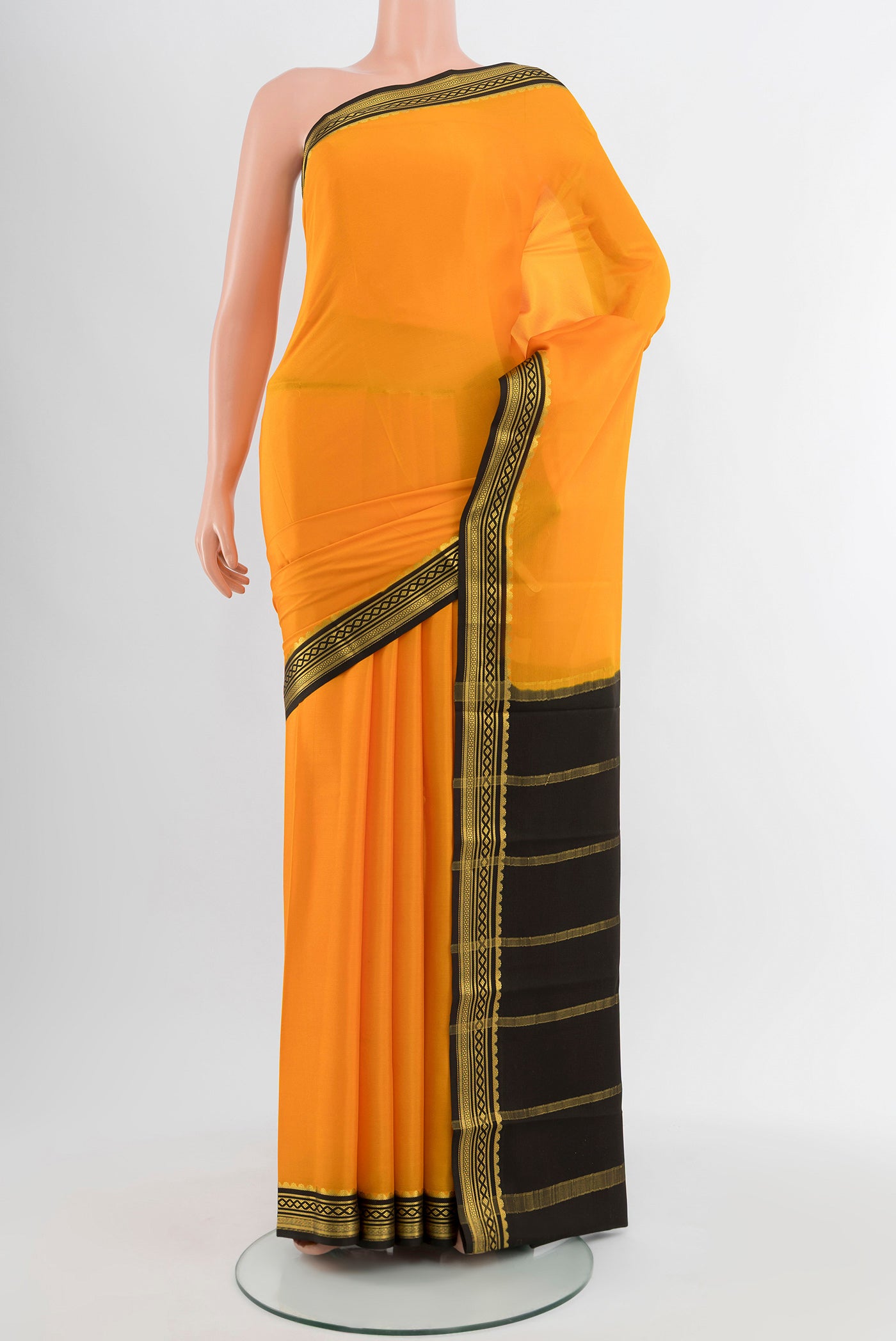 Yellow Mysore Crepe Saree with Plain Body and Silk Border.  displayed on a mannequin