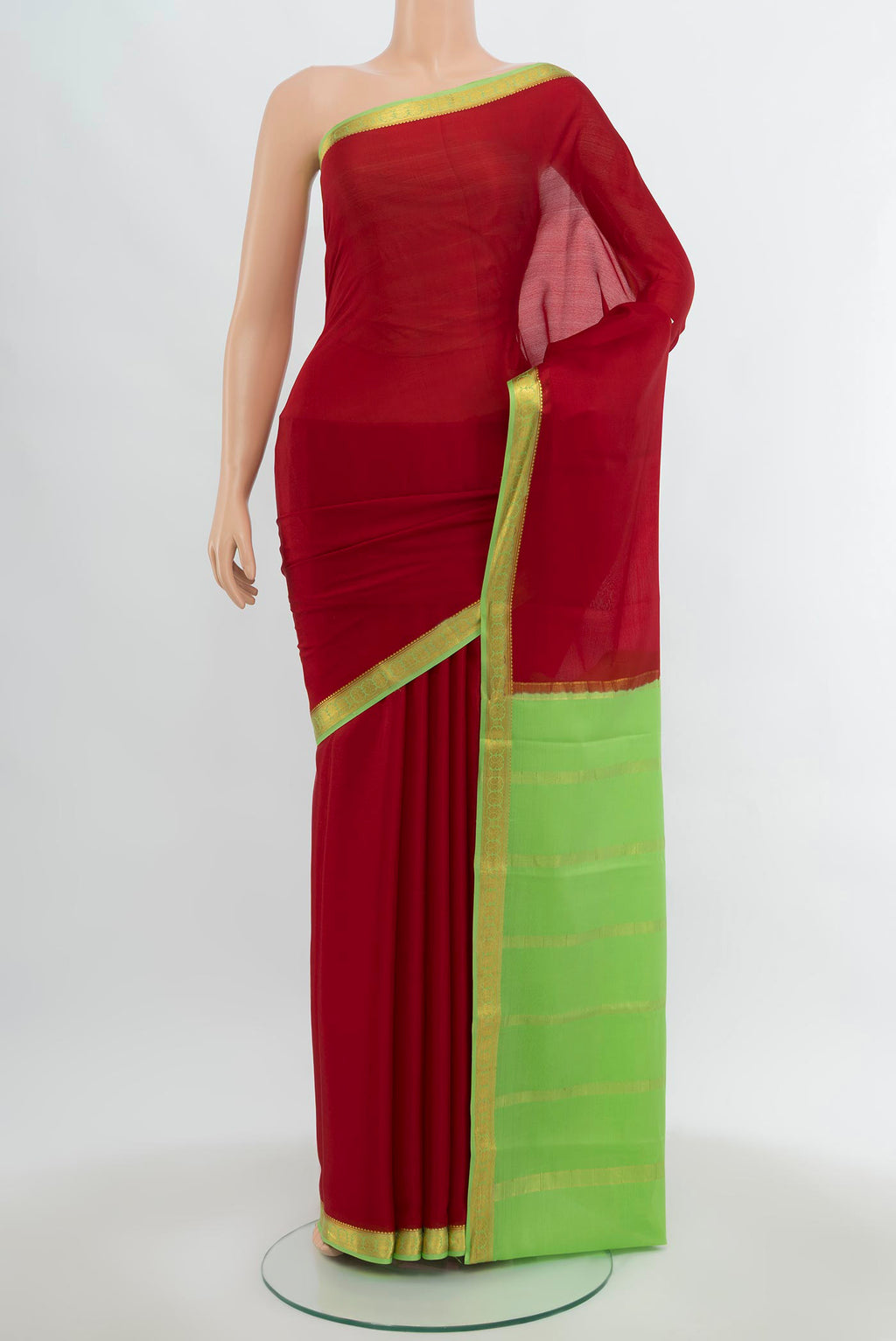 Red Mysore Crepe Saree with Zari Butta on the body and Silk Border.  displayed on a mannequin