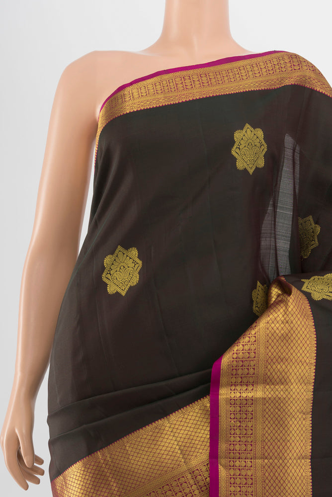 Border image of Black Kanchipuram Silk Saree with Zari Butta on the body and Silk Border. 