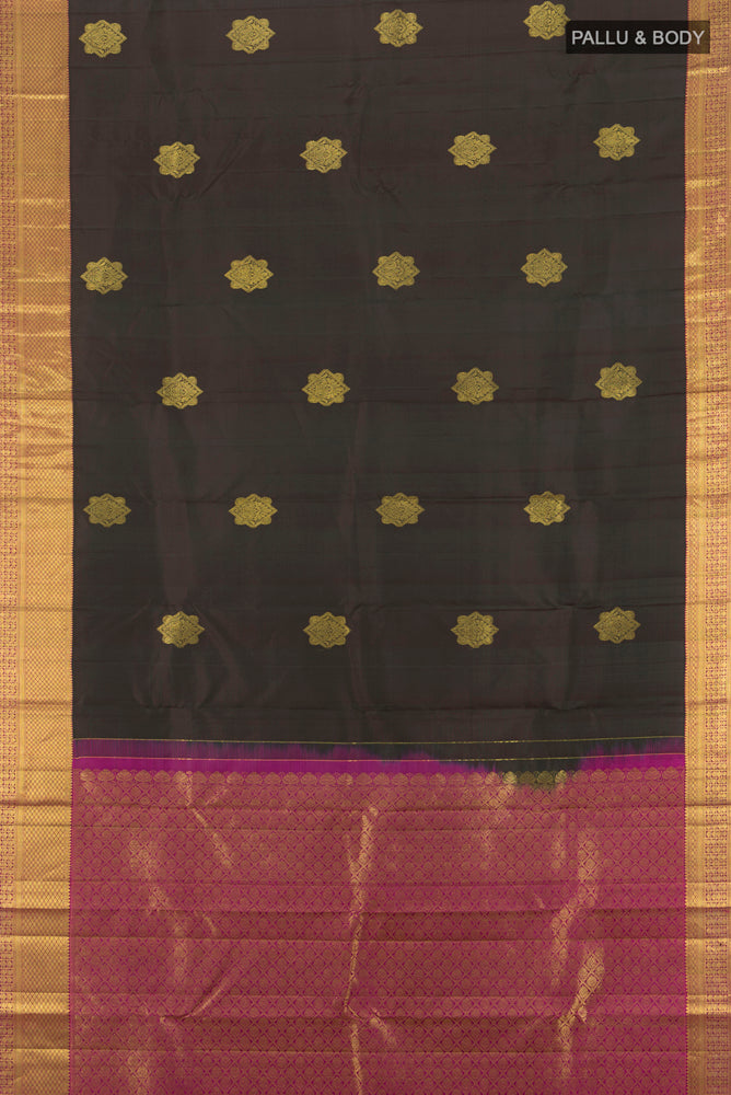 Flat view of Black Kanchipuram Silk Saree with Zari Butta on the body and Silk Border. 