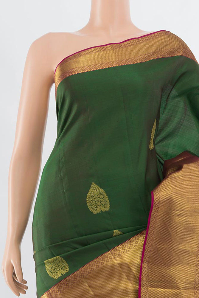 Border image of Bottle Green Kanchipuram Silk Saree with Zari Butta on the body and Silk Border. 