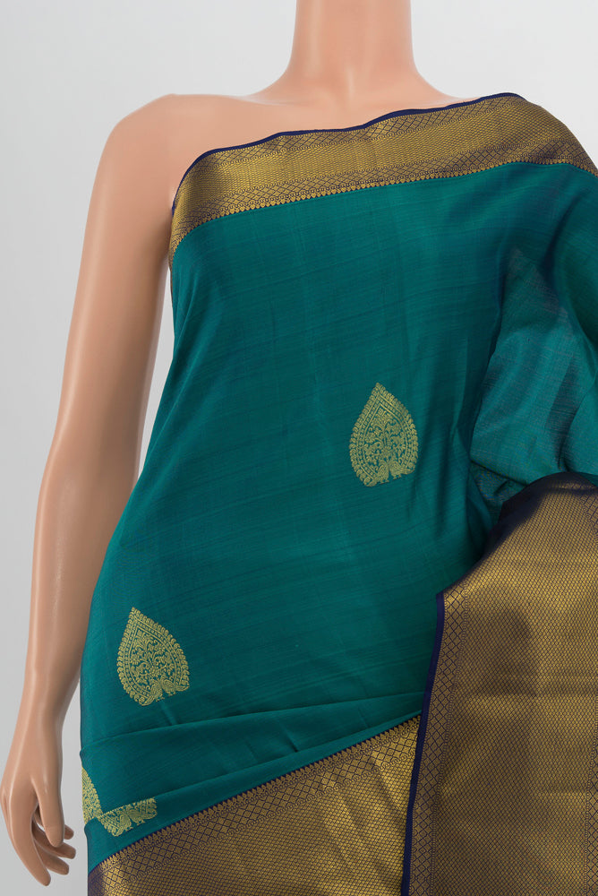 Border image of Peacock Blue Kanchipuram Silk Saree with Zari Butta on the body and Silk Border. 