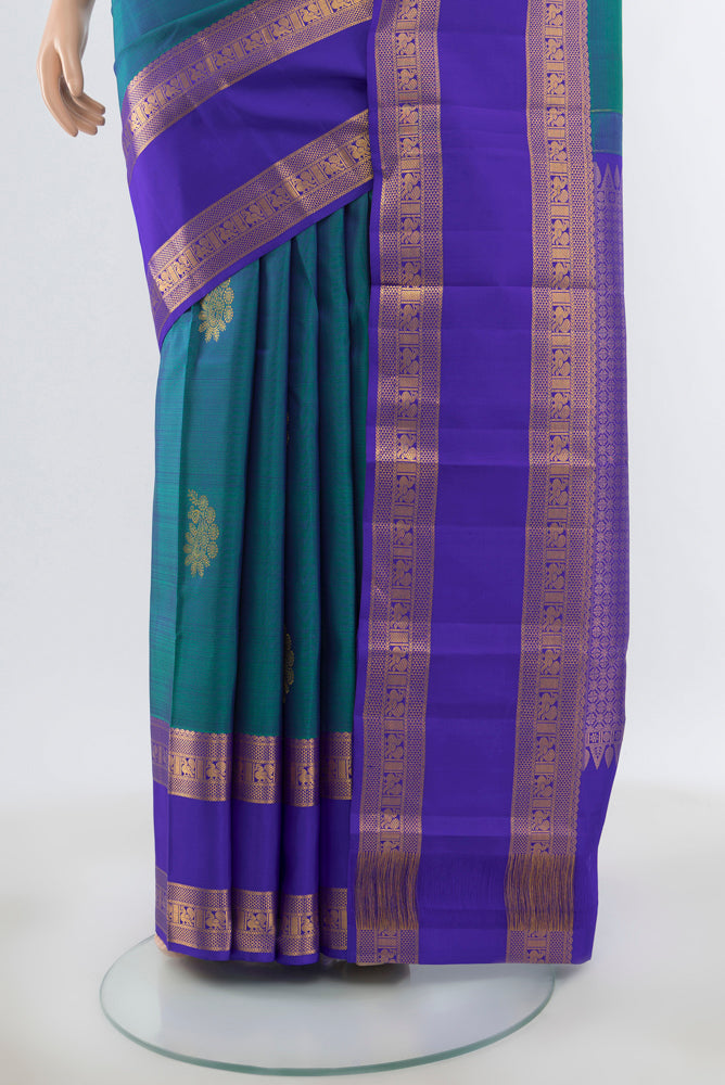 Pleats and pallu of Peacock Blue Kanchipuram Silk Saree with Plain Body and Silk Border. 