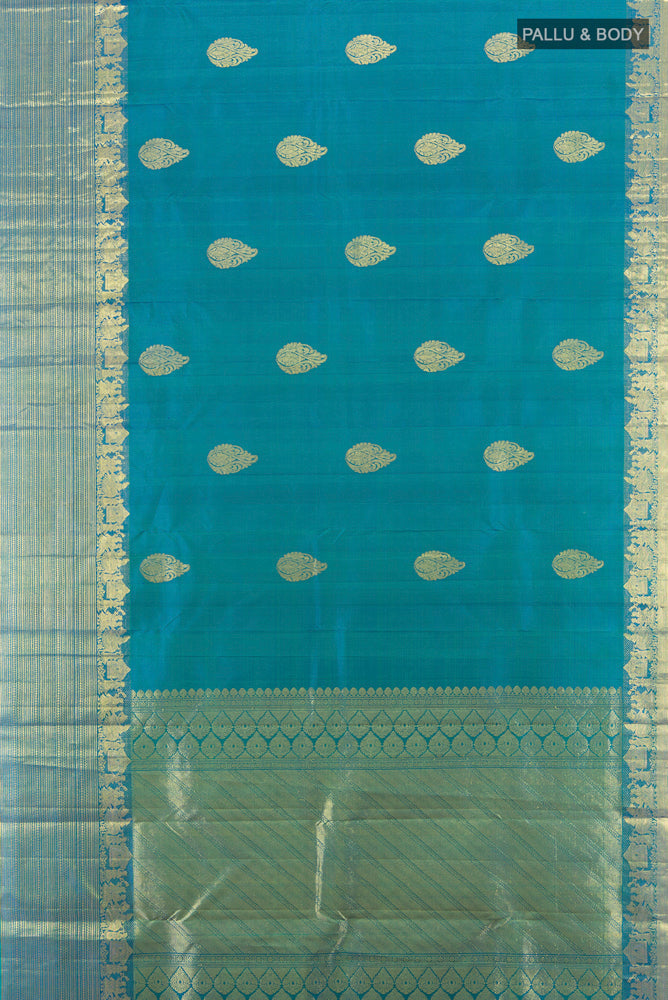 Flat view of Peacock Blue Kanchipuram Silk Saree with Zari Butta on the body and Silk Border. 