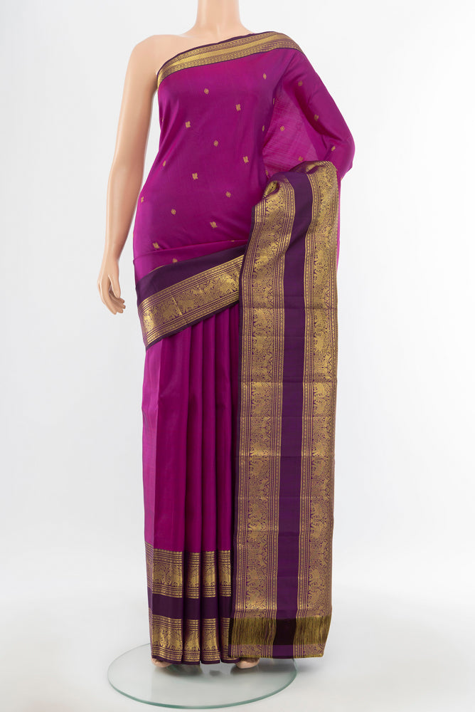 Pure Silk Pure Zari Purple Kanchipuram Saree with Zari Butta on the body and Silk Border.  displayed on a mannequin