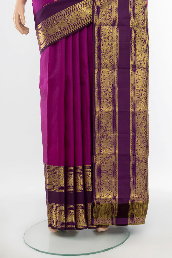 Pleats and pallu of Pure Silk Pure Zari Purple Kanchipuram Saree with Zari Butta on the body and Silk Border. 