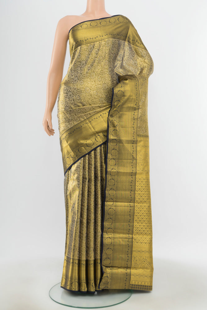 Pure Silk Pure Zari Golden Kanchipuram Saree with Zari Butta on the body and Silk Border.  displayed on a mannequin