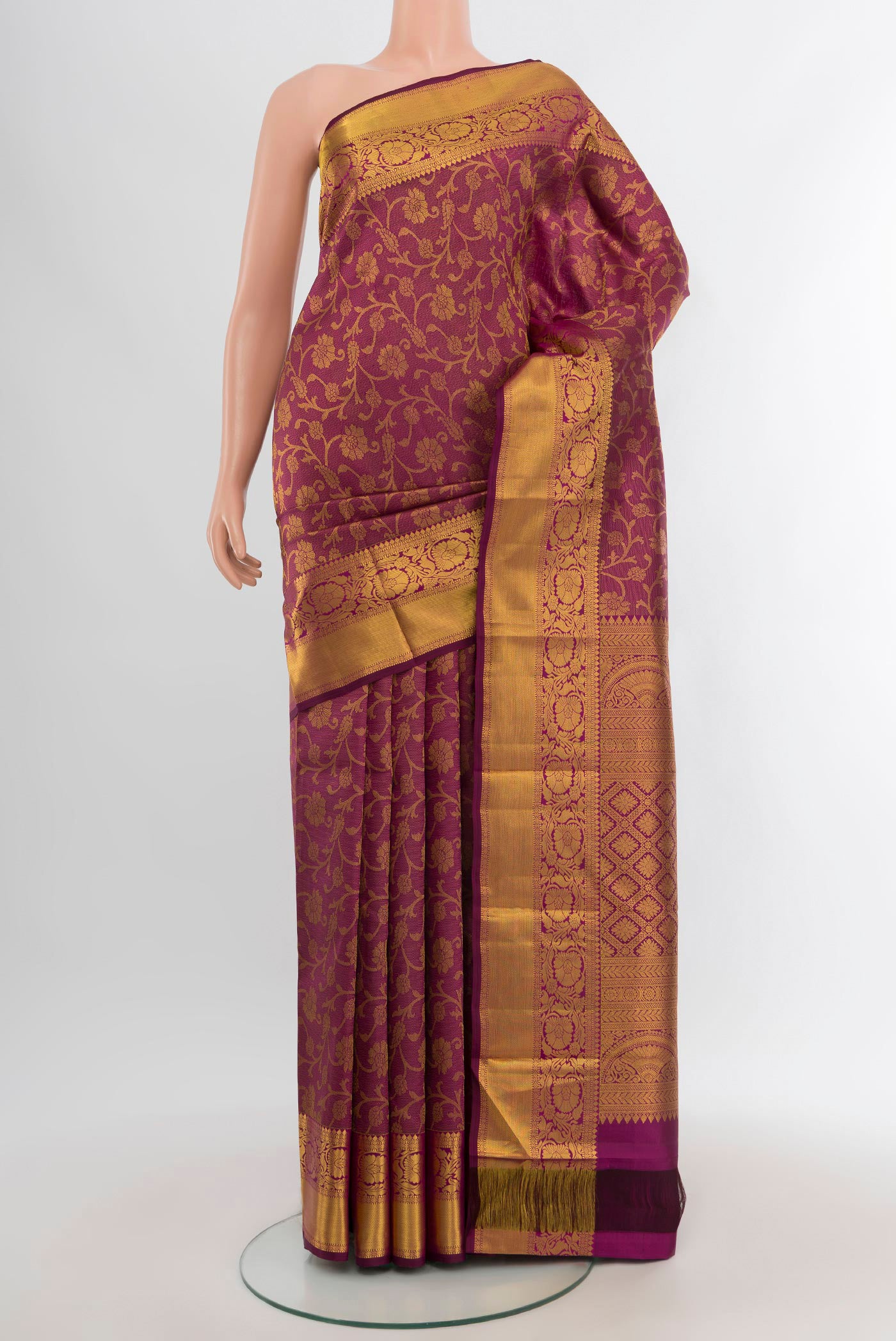 Purple Kanjivaram Silk Saree with Zari Brocade on the body and Zari Border.  displayed on a mannequin