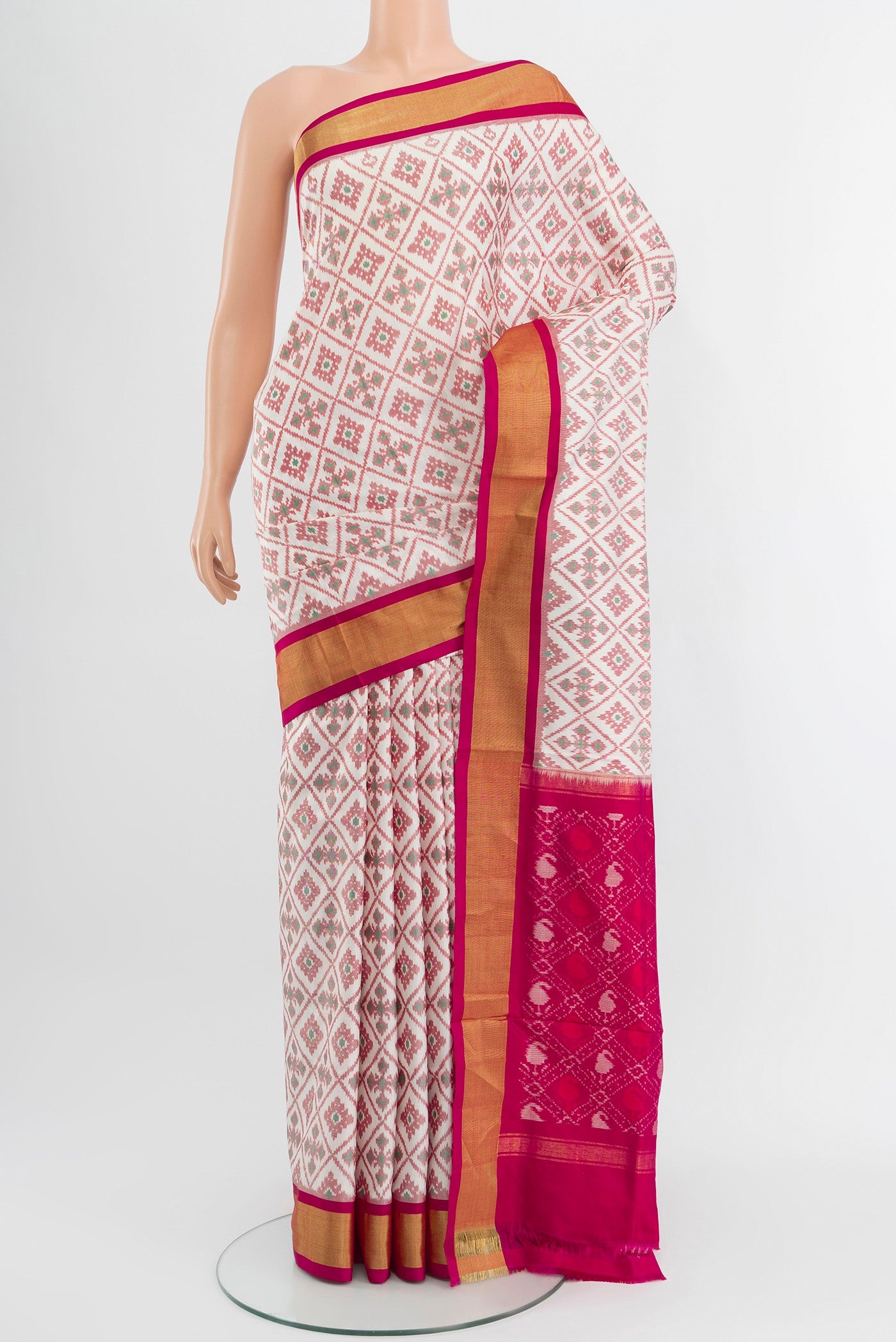 White Pochampally Silk Saree with Pure Ikat on the body and Zari Border.  displayed on a mannequin
