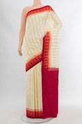 Cream Pochampally Silk Saree with Ikat Print on the body and Silk Border.  displayed on a mannequin