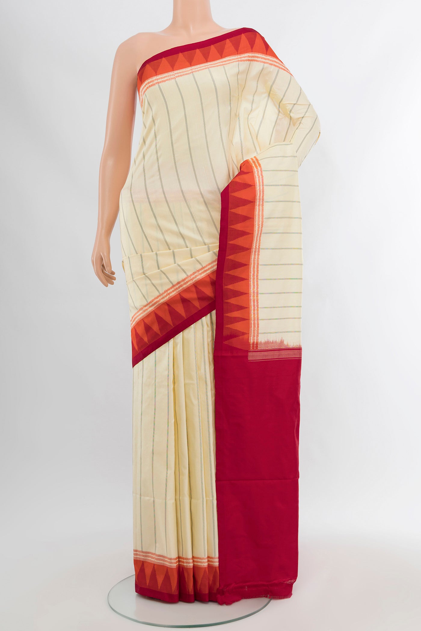 Cream Pochampally Silk Saree with Ikat Print on the body and Silk Border.  displayed on a mannequin