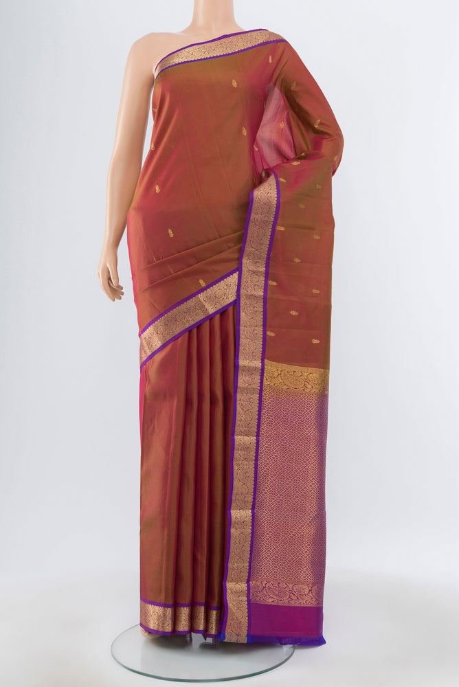 Pure Silk Pure Zari Maroon Kanjivaram Saree with Zari Butta on the body and Silk Border.  displayed on a mannequin