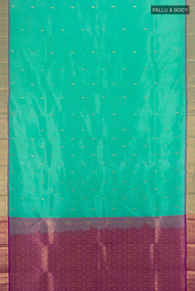 Flat view of Sky Blue Kanjivaram Silk Saree with Zari Butta on the body and Silk Border. 