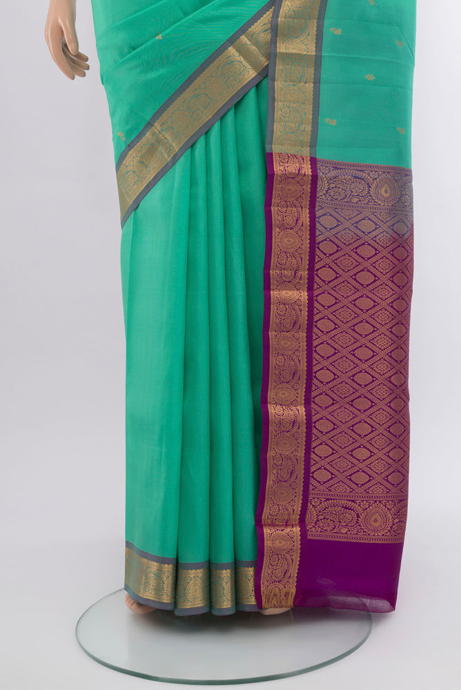 Pleats and pallu of Sky Blue Kanjivaram Silk Saree with Zari Butta on the body and Silk Border. 