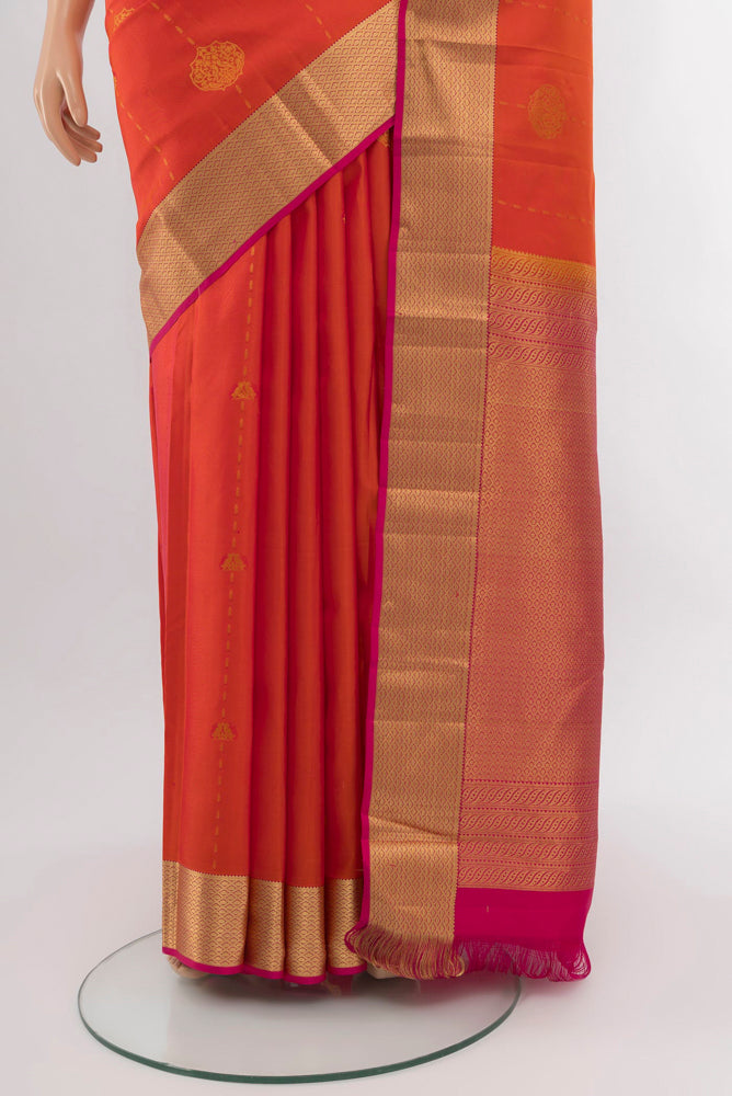 Pleats and pallu of Peach Kanchipuram Silk Saree with Zari Brocade on the body and Silk Border. 