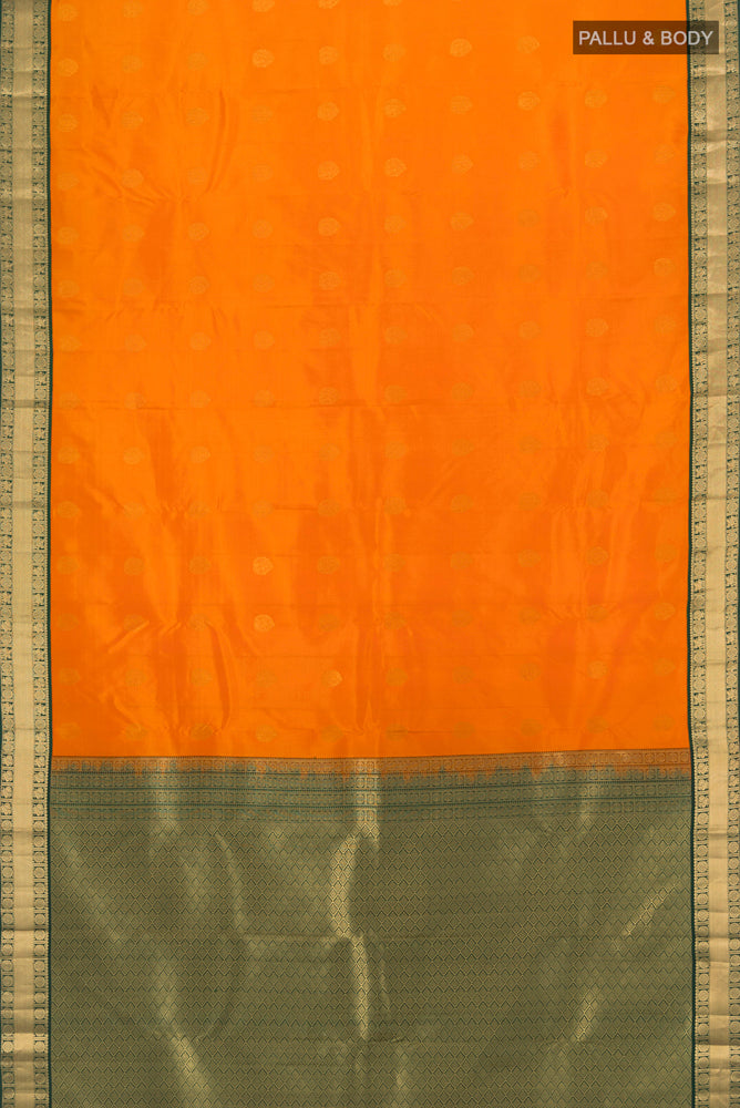 Flat view of Yellow Kanchipuram Silk Saree with Zari Butta on the body and Silk Border. 