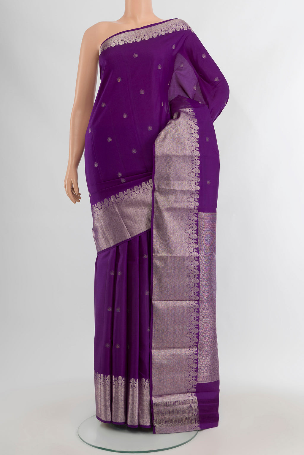 Violet Kanchipuram Silk Saree with Zari Butta on the body and Zari Border.  displayed on a mannequin