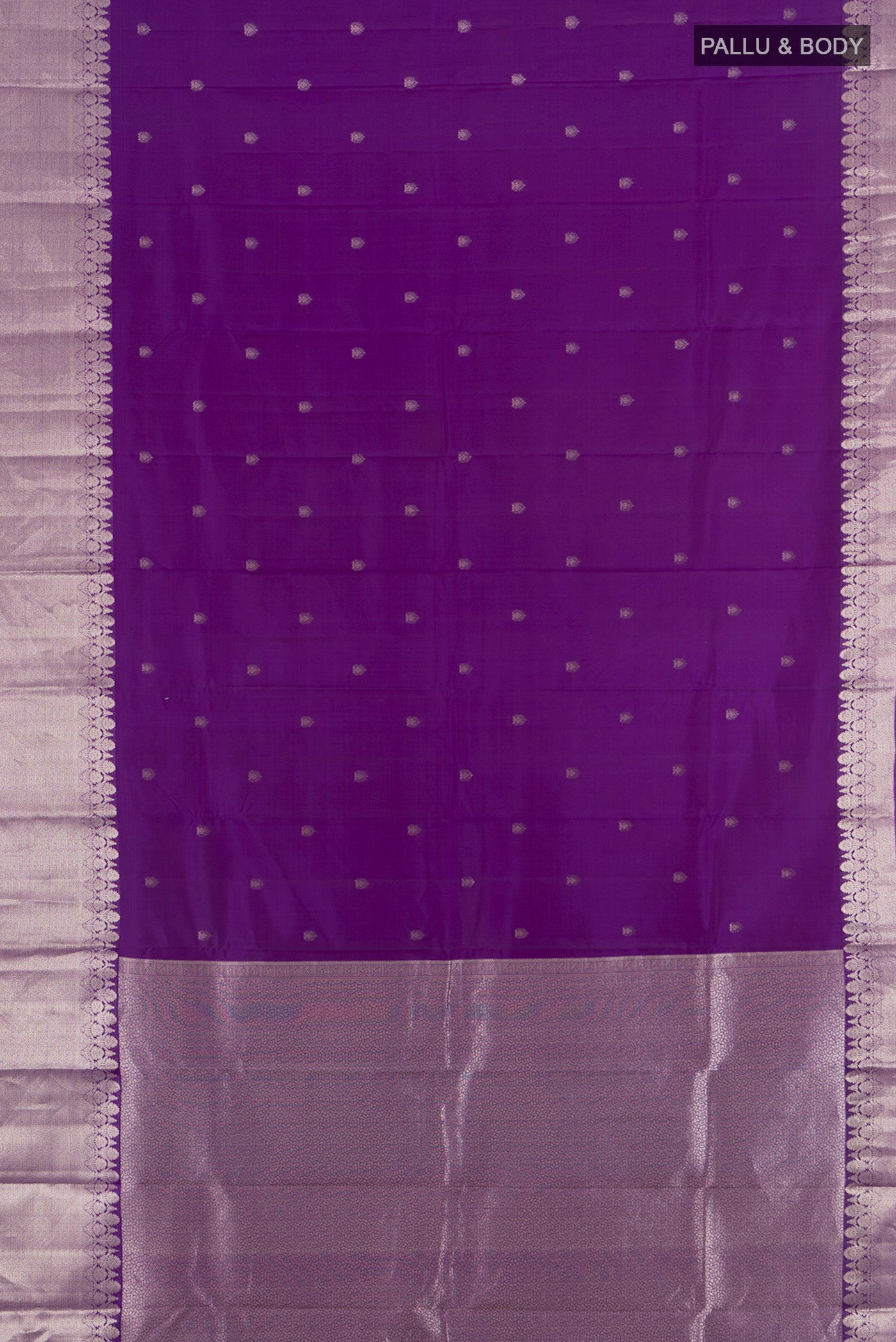 Flat view of Violet Kanchipuram Silk Saree with Zari Butta on the body and Zari Border. 