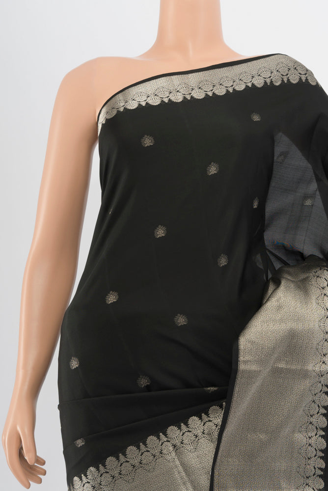 Border image of Black Kanchipuram Silk Saree with Zari Butta on the body and Silk Border. 
