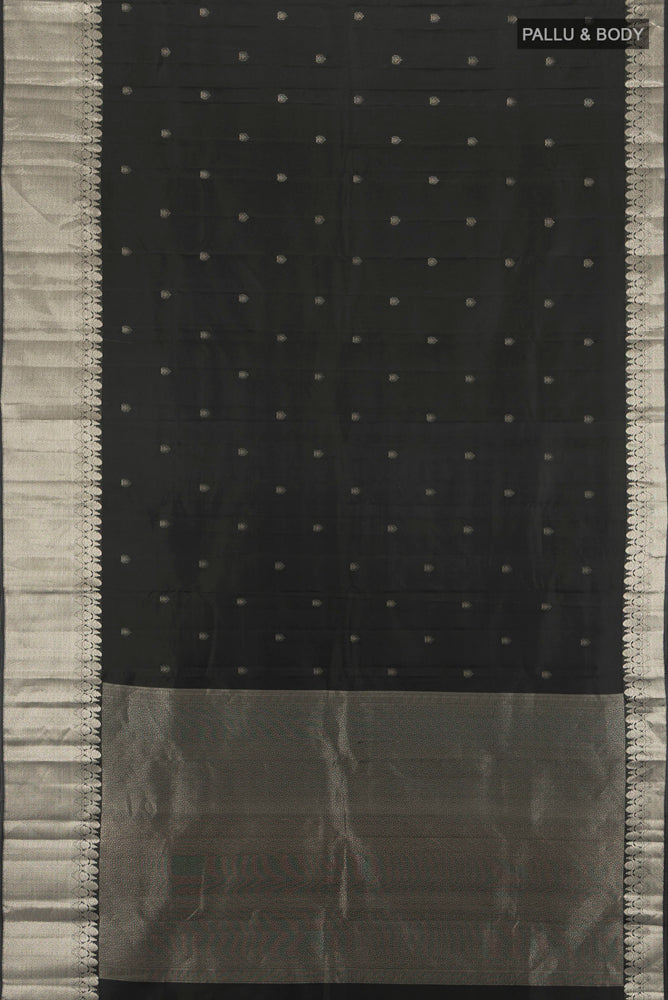 Flat view of Black Kanchipuram Silk Saree with Zari Butta on the body and Silk Border. 