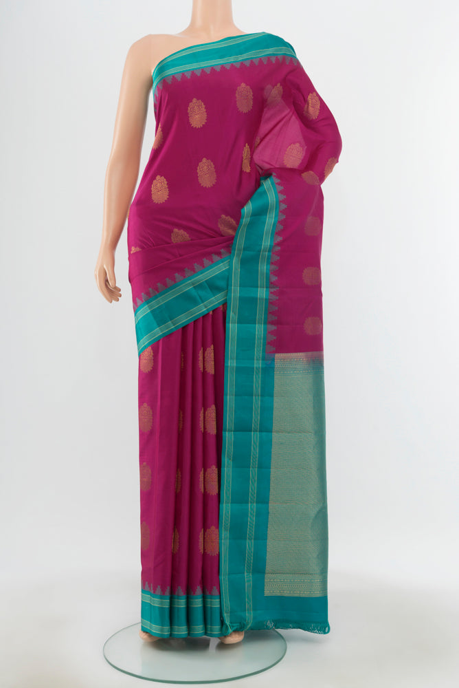 Pure Silk Pure Zari Purple Kanchipuram Saree with Zari Butta on the body and Silk Border.  displayed on a mannequin