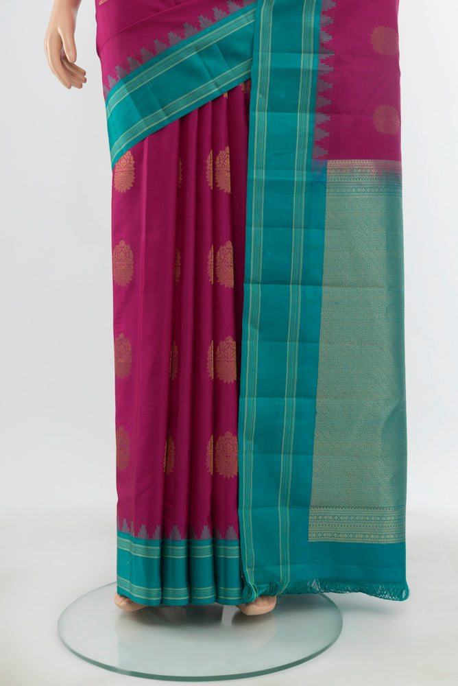 Pleats and pallu of Pure Silk Pure Zari Purple Kanchipuram Saree with Zari Butta on the body and Silk Border. 