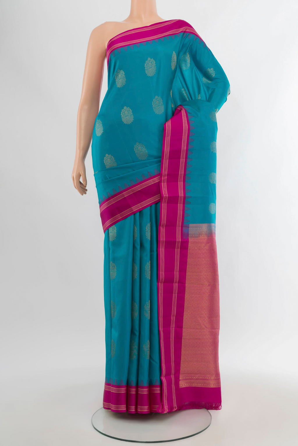 Blue Kanchipuram Silk Saree with Zari Butta on the body and Zari Border.  displayed on a mannequin
