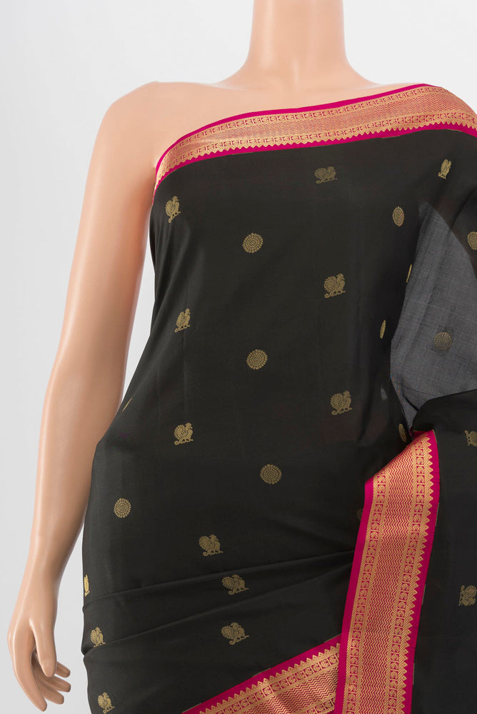 Border image of Black Kanchipuram Silk Saree with Zari Butta on the body and Silk Border. 